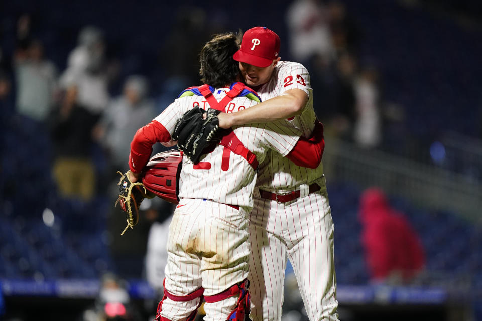 Philadelphia Phillies' Corey Knebel, right, and Garrett Stubbs celebrate after a baseball game against the Colorado Rockies, Wednesday, April 27, 2022, in Philadelphia. (AP Photo/Matt Slocum)