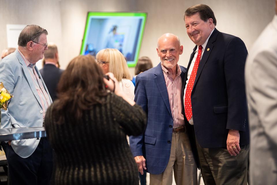 Area auctioneer William "Bear" Stephenson, left, poses for a photo with Oak Ridge City Manager Mark Watson during Watson's retirement reception.