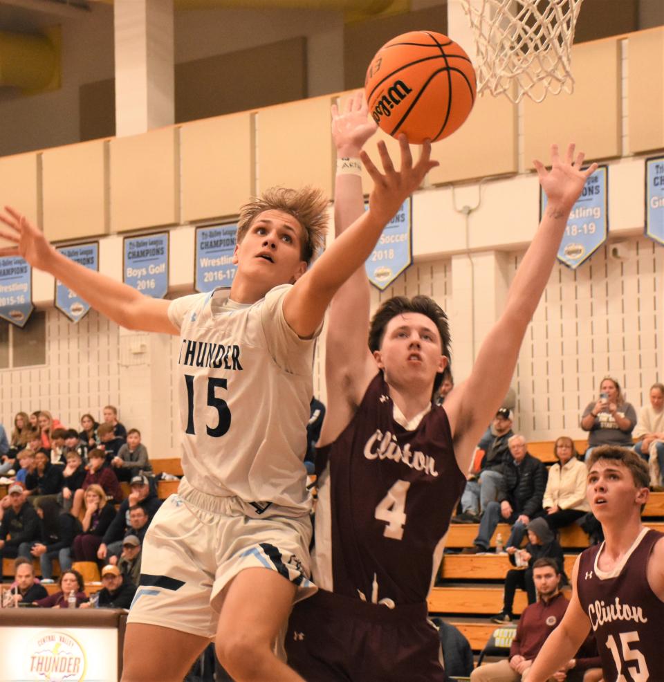 Central Valley Academy's Deacon Judd (15) reaches for a loose ball in front of Clinton Warrior Pat Ward Tuesday.