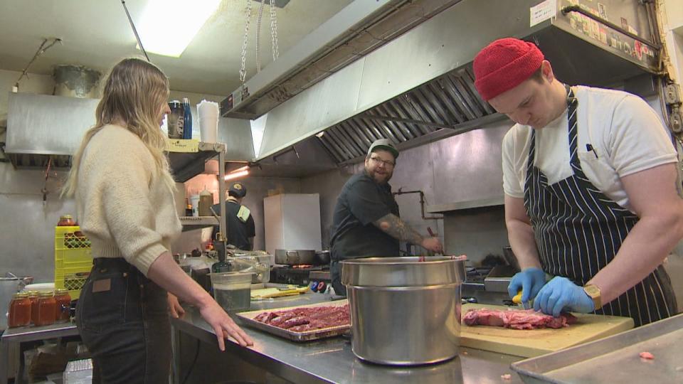 Chef Christie Peters speaks with staff in the kitchen at her restaurant Primal.