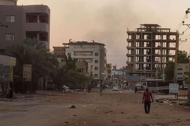 PHOTO: People walk on an almost empty street in southern Khartoum, May 2, 2023. (-/AFP via Getty Images)