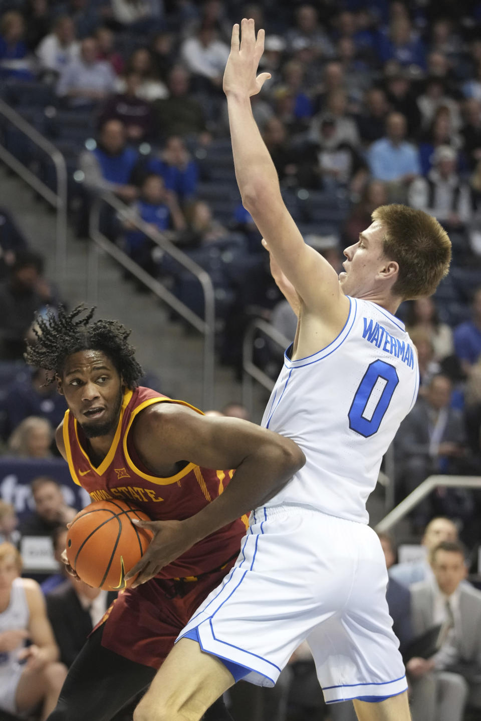 Iowa State forward Tre King (left) is defended by BYU forward Noah Waterman (0) during the first half of an NCAA college basketball game Tuesday, Jan. 16, 2024, in Provo, Utah. (AP Photo/George Frey)