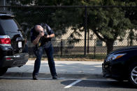 <p>A crime scene investigator takes a photograph near the Eugene Simpson Stadium Park in Alexandria, Virginia, U.S., on Wednesday, June 14, 2017. (Photo: Andrew Harrer/Bloomberg via Getty Images) </p>