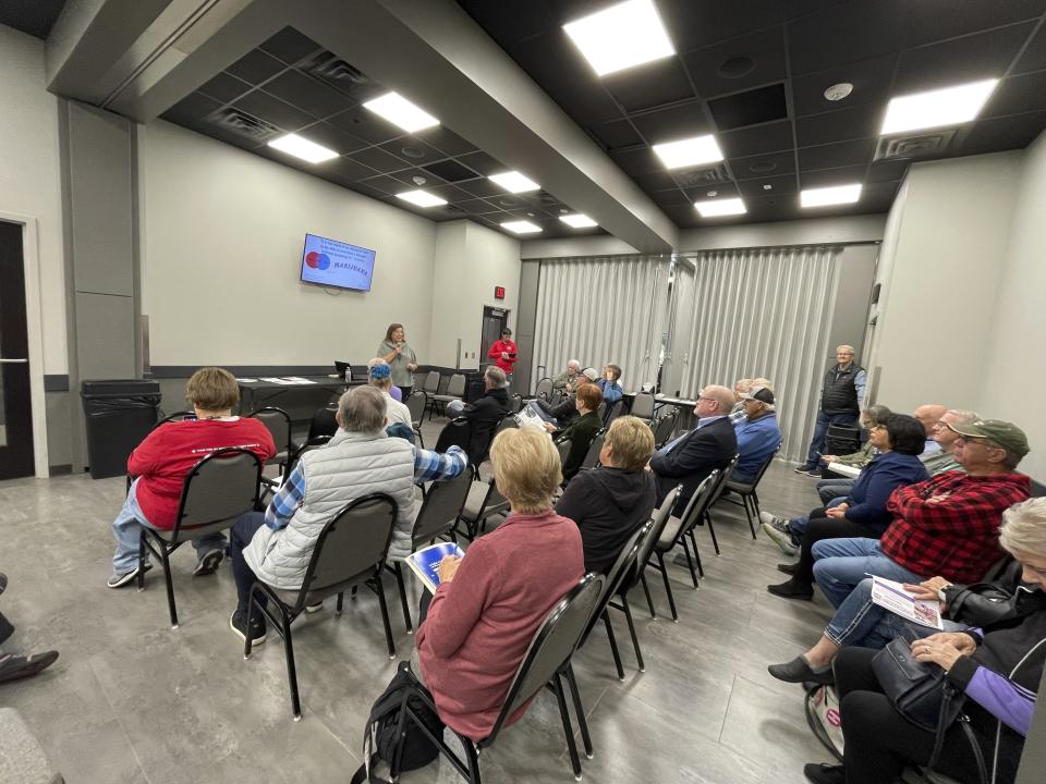 FILE - Marijuana legalization opponents meet in a Sioux Falls, S.D. on Oct. 7, 2022 to hear a presentation on the dangers of pot use and strategize how to convince their friends and neighbors not to pass legalization a second time. Advocates of legalizing recreational marijuana, a mission with a rocky history in South Dakota, submitted thousands of signatures to election officials on Tuesday, May 7, 2024, in the hopes of once again getting the issue on the conservative state's November ballot. (AP Photo/Stephen Groves, File)