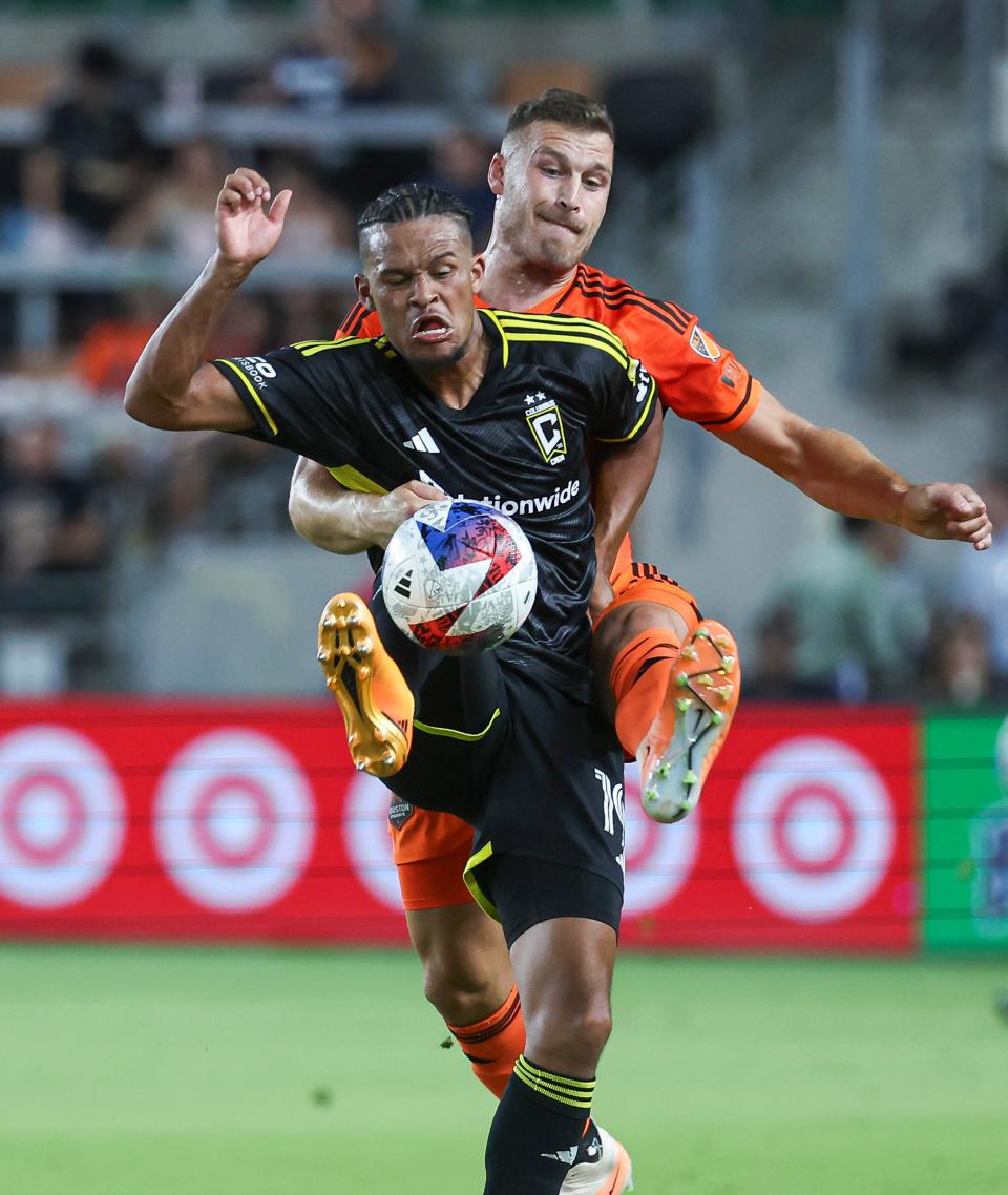 Aug 30, 2023; Houston, Texas, USA; Columbus Crew SC forward Jacen Russell-Rowe (19) and Houston Houston Dynamo FC defender Erik Sviatchenko (28) battle for the ball during the first half at Shell Energy Stadium. Mandatory Credit: Troy Taormina-USA TODAY Sports