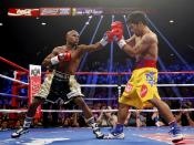 Floyd Mayweather, Jr. of the U.S. (L) and Manny Pacquiao of the Philippines fight in the first round of their welterweight WBO, WBC and WBA (Super) title fight in Las Vegas, Nevada, May 2, 2015. REUTERS/Steve Marcus