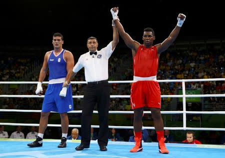 2016 Rio Olympics - Boxing - Preliminary - Men's Super Heavy (+91kg) Round of 16 Bout 161 - Riocentro - Pavilion 6 - Rio de Janeiro, Brazil - 13/08/2016. Lenier Pero (CUB) of Cuba celebrates after winning his bout against Guido Vianello (ITA) of Italy. REUTERS/Peter Cziborra