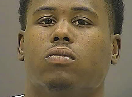 Raymon Carter, 24, is seen in an undated picture released by the Baltimore Police Department in Baltimore, Maryland. REUTERS/Baltimore Police Department/Handout