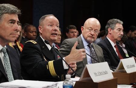 General Keith Alexander (2nd L), director of the National Security Agency (NSA) testifies at a House Intelligence Committee hearing on Capitol Hill in Washington October 29, 2013. REUTERS/Jason Reed