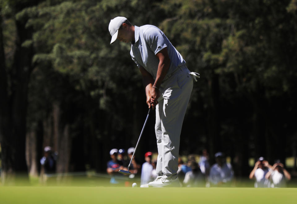 Tiger Woods putts on the 1st green during the first round of the the WGC-Mexico Championship at the Chapultepec Golf Club in Mexico City, Thursday, Feb. 21, 2019. (AP Photo/Marco Ugarte)
