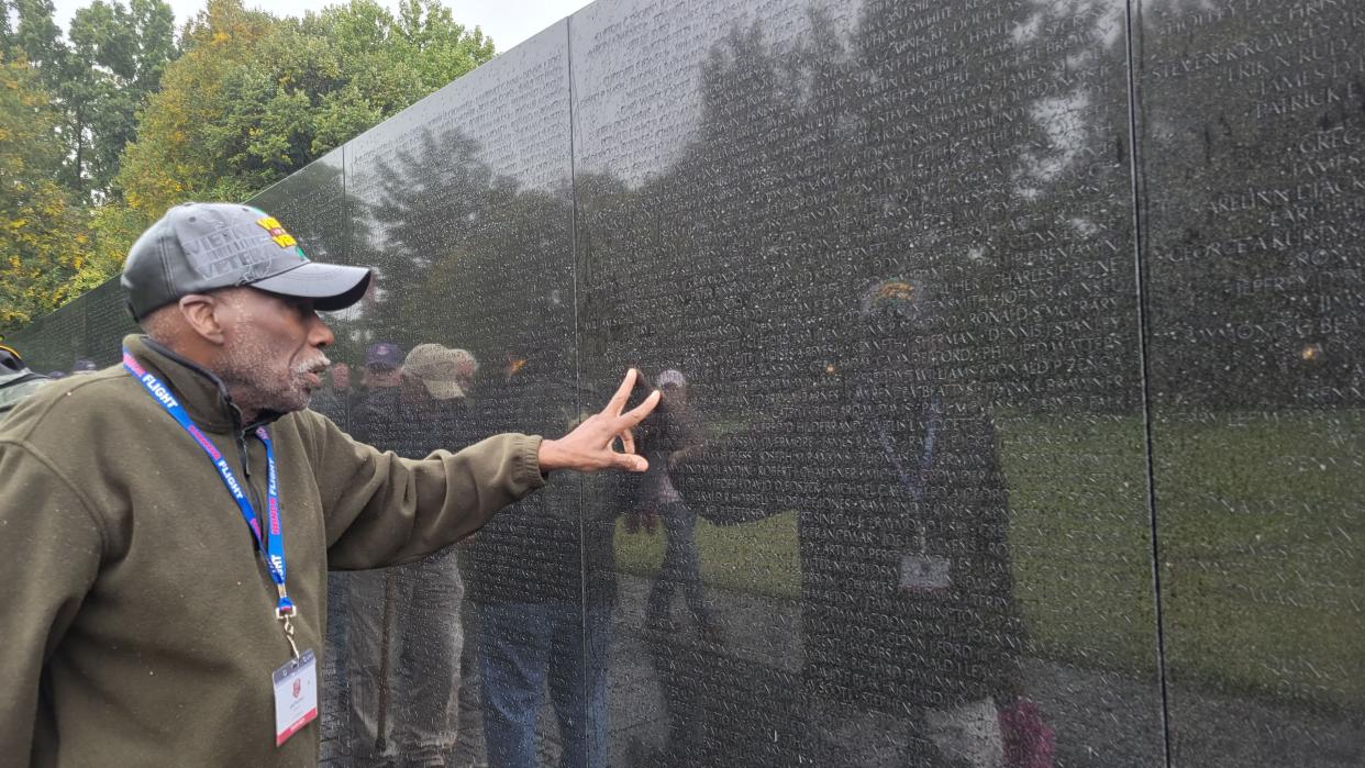 Hendersonville's Anthony Sweat looks for a name on the Vietnam Wall on Oct. 1 during the Blue Ridge Honor Flight's visit to Washington, D.C.