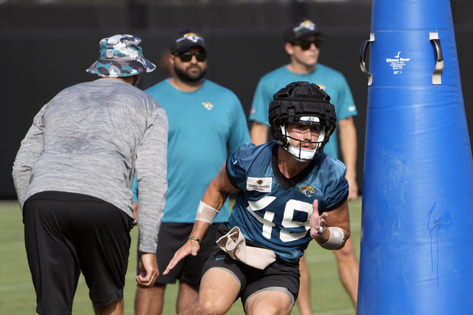 Jacksonville Jaguars tight end Josh Pederson (49) performs a drill during a practice at NFL football training camp, Thursday, July 27, 2023, in Jacksonville, Fla. (AP Photo/John Raoux)