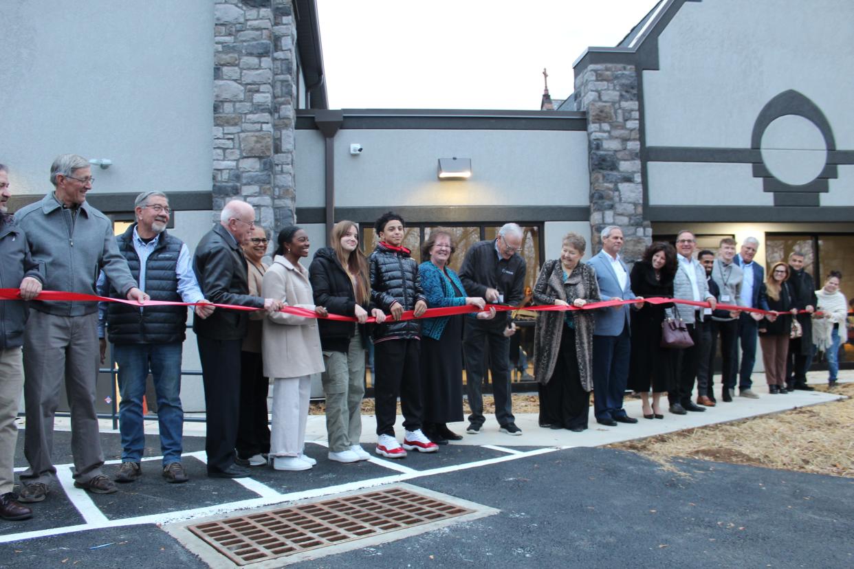 Youth who attended True Life, board members, donors, contractors and elected officials alongside executive director Jerry Higley cut the ribbon to True Life Youth Ministries new center at 1300 W. Maple St.