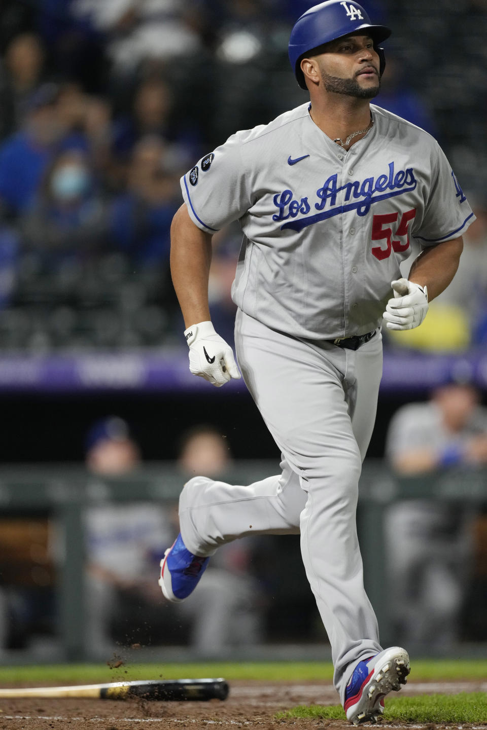 Los Angeles Dodgers pinch-hitter Albert Pujols runs up the first-base line after popping out against Colorado Rockies relief pitcher Lucas Gilbreath in the ninth inning of a baseball game Wednesday, Sept. 22, 2021, in Denver. The Rockies won 10-5. (AP Photo/David Zalubowski)