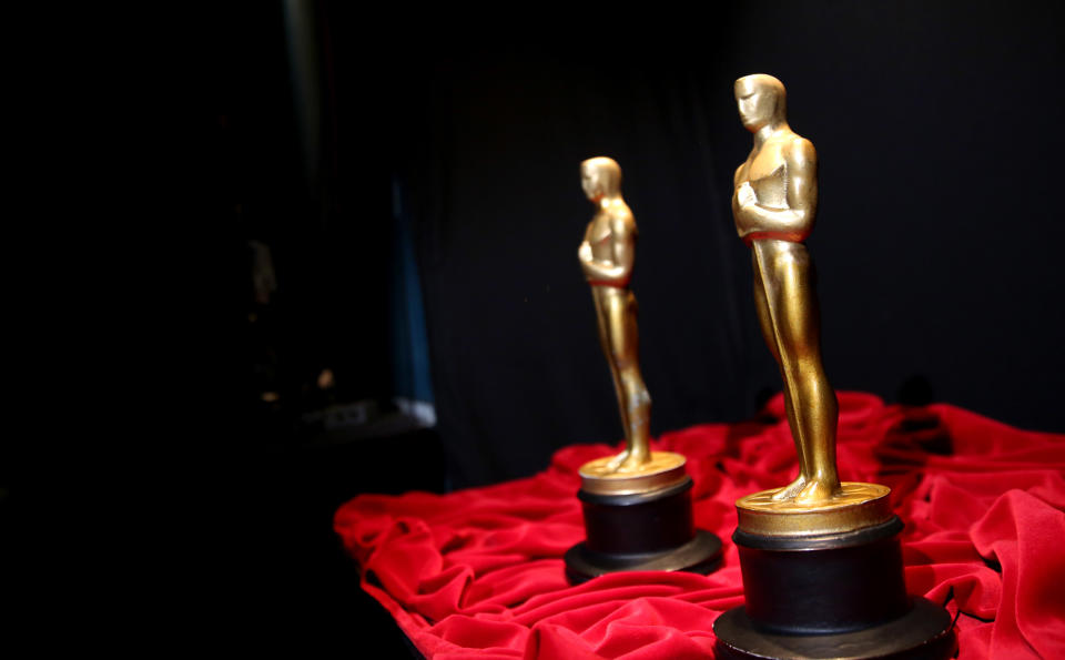 A pair of prop Oscars are seen backstage during rehearsals for the 86th Academy Awards in Los Angeles, Friday, Feb. 28, 2014. The Academy Awards will be held at the Dolby Theatre on Sunday, March 2. (Photo by Matt Sayles/Invision/AP)