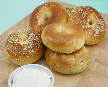 A whole wheat bagel with a light spread of low-fat cream cheese.