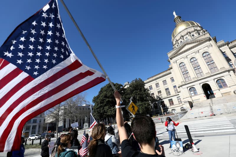 FILE PHOTO: Protesters rally against voting restrictions in U.S. state of Georgia