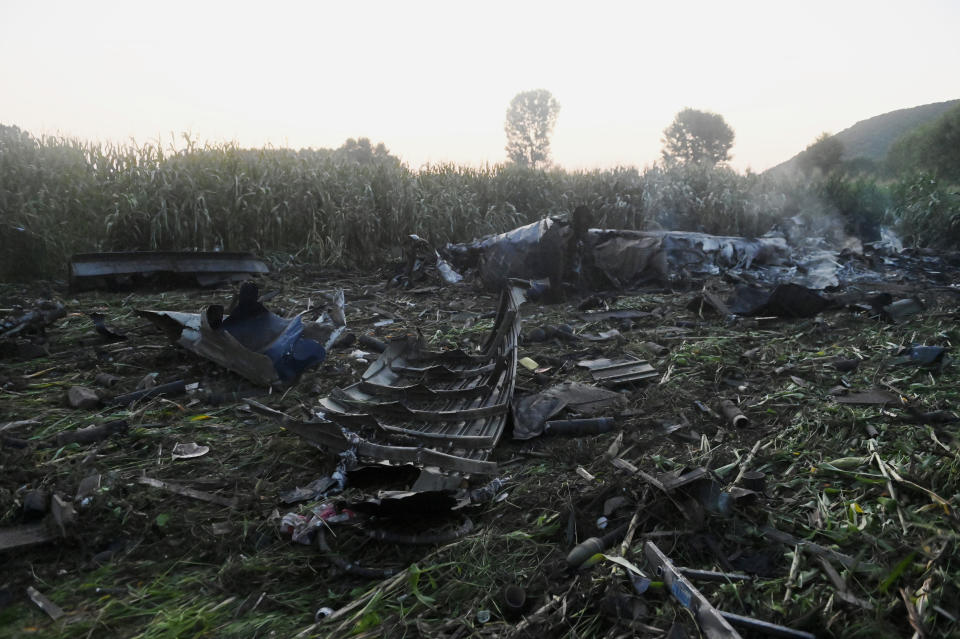 Debris of an Antonov cargo plane is seen in Palaiochori village in northern Greece, Sunday, July 17, 2022, after it reportedly crashed Saturday near the city of Kavala. The An-12, a Soviet-built turboprop aircraft operated by the Ukrainian cargo carrier Meridian, crashed late Saturday as Greek Civil Aviation authorities said the flight was heading from Serbia to Jordan. (AP Photo/Giannis Papanikos)