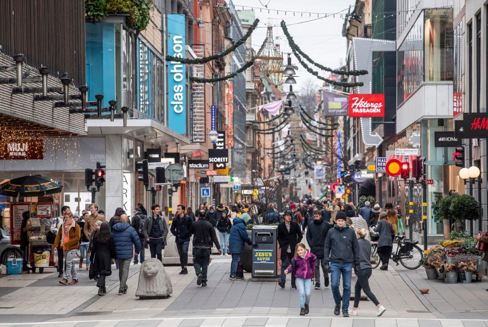 People stroll at the Drottninggatan shopping street in central Stockholm on November 10. Source: Getty