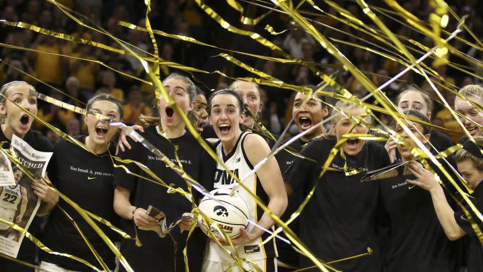 Clark celebrates with her teammates after breaking the NCAA women's all-time scoring record in February. - Matthew Holst/Getty Images