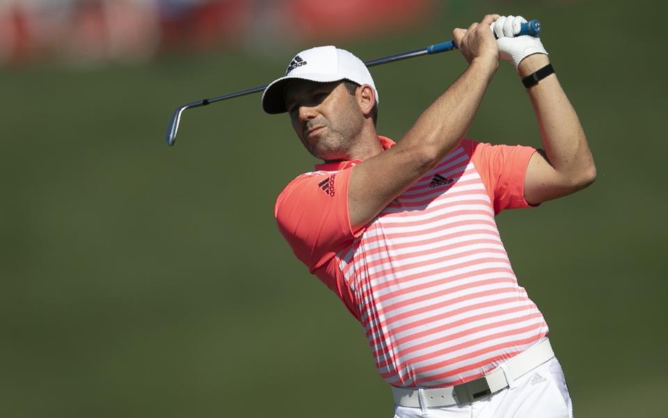 Spain's Sergio Garcia plays a shot on the first fairway during the final round of the Abu Dhabi Championship golf tournament in Abu Dhabi, United Arab Emirates, Sunday, Jan. 19, 2020. (AP Photo/Kamran Jebreili)