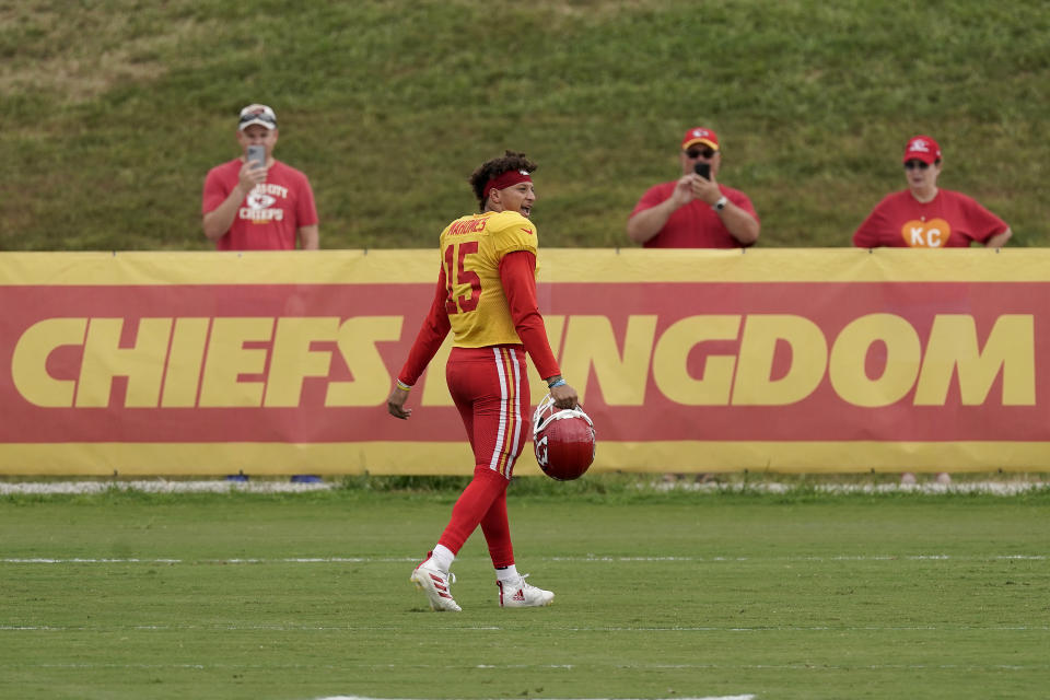 Kansas City Chiefs quarterback Patrick Mahomes walks between drills during NFL football training camp Monday, Aug. 15, 2022, in St. Joseph, Mo. (AP Photo/Charlie Riedel)