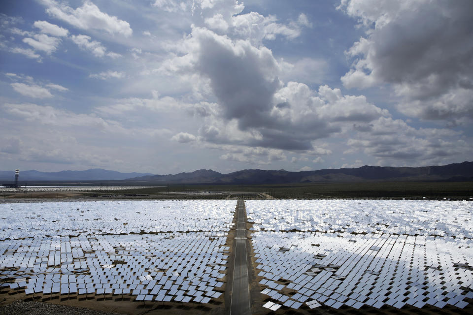 FILE - This Aug. 13, 2014, file photo, shows an array of mirrors at the Ivanpah Solar Electric Generating site in Primm, Nev. Some projects, including the approved $1 billion Gemini solar and battery storage project about 30 miles northeast of Las Vegas, have sparked debate about whether they are simply too big. (AP Photo/John Locher, File)