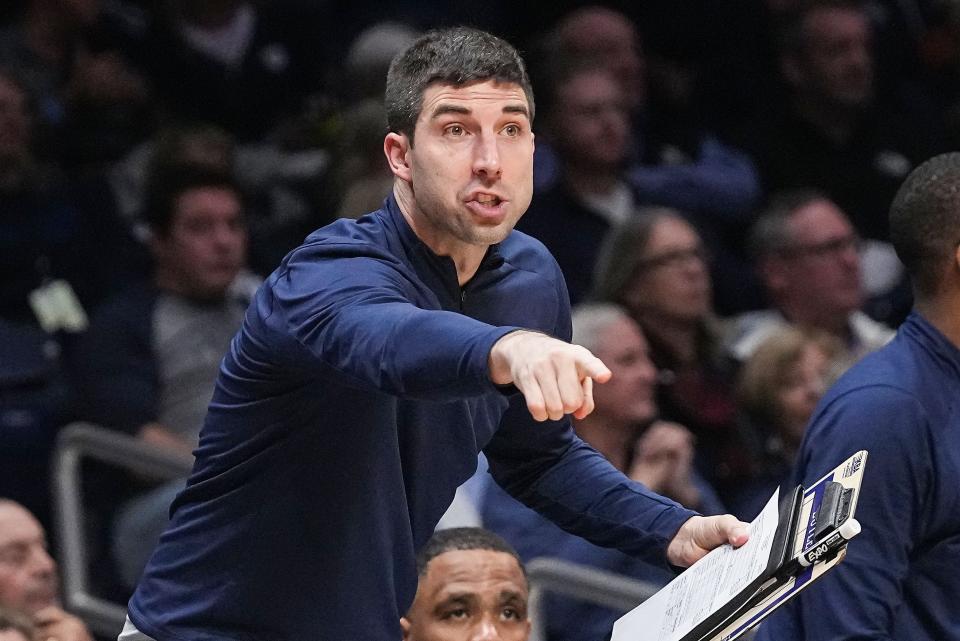 Butler Bulldogs assistant coach Jon Diebler yells to players from the sidelines Thursday, Nov. 30, 2023, during the game at Hinkle Fieldhouse in Indianapolis. The Butler Bulldogs defeated the Texas Tech Red Raiders in overtime, 103-95.