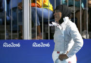 <p>Ibtihaj Muhammad of USA reacts after losing the match in her women’s sabre team semifinal on August 13, 2016. (REUTERS/Issei Kato) </p>