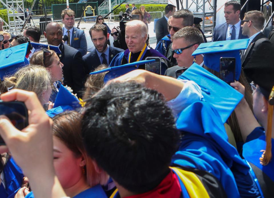 President Joe Biden briefly greets graduates after the University of Delaware's 2022 Commencement at Delaware Stadium, Saturday, May 28, 2022.