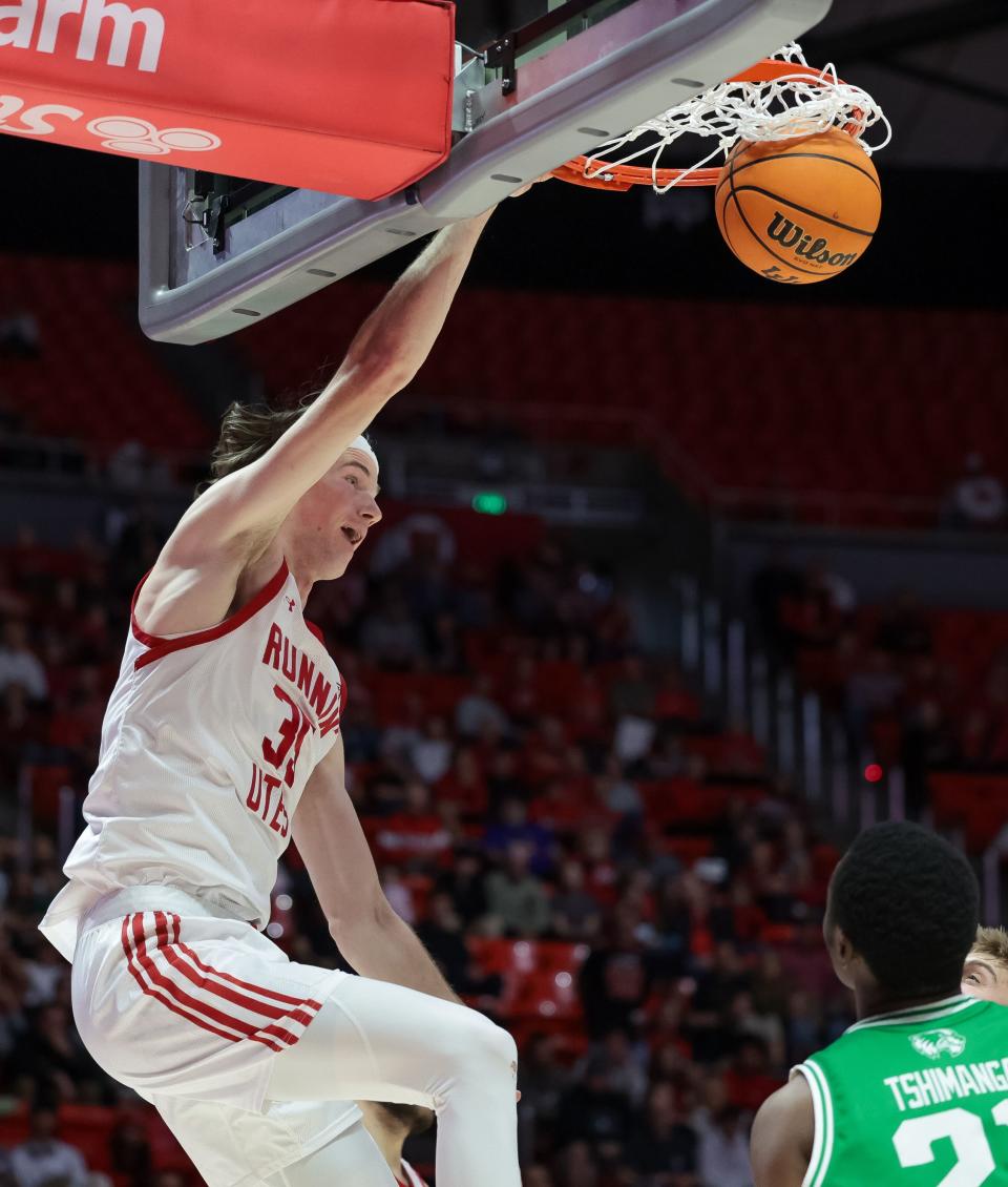 Utah Utes center Branden Carlson (35) dunks during the game against the Utah Valley Wolverines at the Huntsman Center in Salt Lake City on Saturday, Dec. 16, 2023. | Spenser Heaps, Deseret News