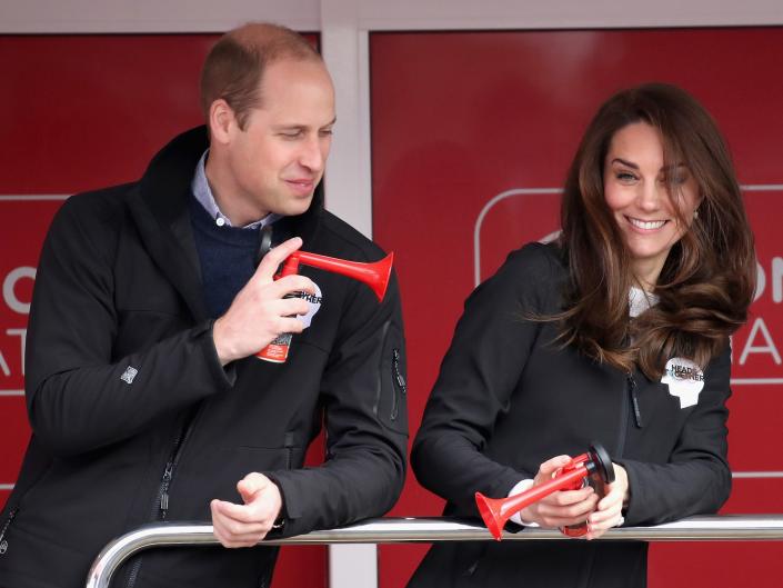Prince William blows an air horn at Kate Middleton in London.