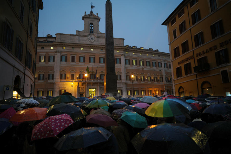 Protesters gather during a demonstration in support of German humanitarian group Sea-Watch, in front of the Italian lower chamber’s Montecitorio palace, in Rome, Monday, Jan. 28, 2019. A Sea-Watch rescue ship that picked up 47 migrants off the Libyan coasts on Jan. 19, was allowed to shelter in the Italian territorial waters due to threatening weather last Thursday, but the government refuses to let aid groups disembark the migrants in Italian ports. (AP Photo/Andrew Medichini)