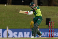 Pakistan's captain Babar Azam plays a shot during the fourth and final T20 cricket match between South Africa and Pakistan at Centurion Park in Pretoria, South Africa, Friday, April 16, 2021. (AP Photo/Themba Hadebe)