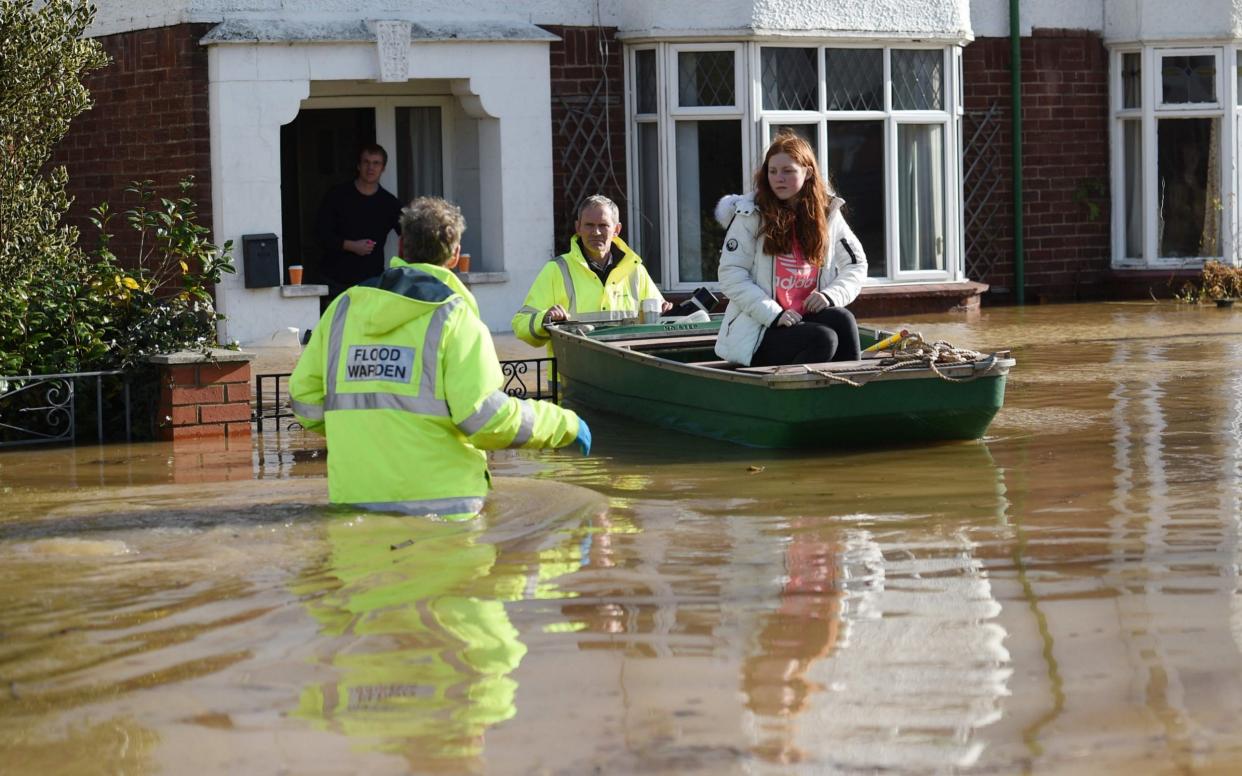 Residents are rescued from their homes in Hereford - AFP/Oli Scarff