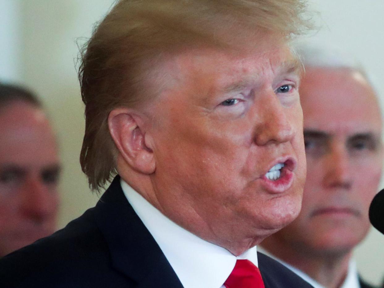 FILE PHOTO: U.S. President Donald Trump delivers remarks following missile attacks by Iran on U.S. bases in Iraq as Vice President Mike Pence looks on in the Grand Foyer at the White House in Washington, U.S. January 8, 2020.  REUTERS/Jonathan Ernst