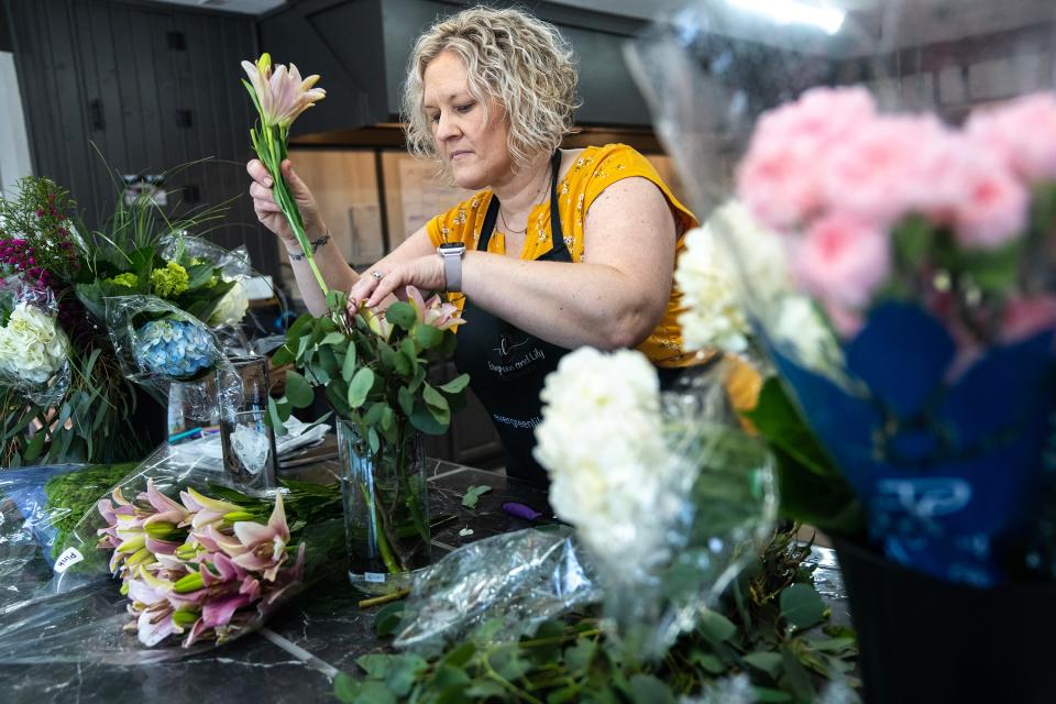 Jen Drake creates bouquets for Mother's Day in her flower shop Evergreen & Lily Floral Studio.