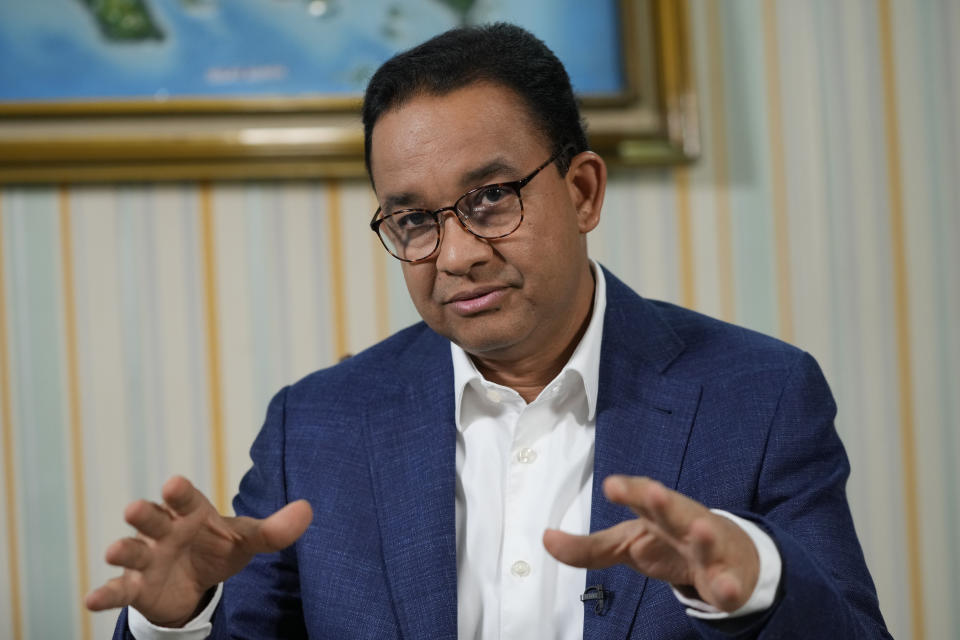 Presidential candidate Anies Baswedan gestures as he speaks during an interview with The Associated Press on the sidelines of his campaign rally in Bandar Lampung Timur, Indonesia, Sunday, Jan. 14, 2024. The former Jakarta governor seeking Indonesia's presidency said democracy is declining in the country and pledged to make changes to get it back on track. (AP Photo/Achmad Ibrahim)