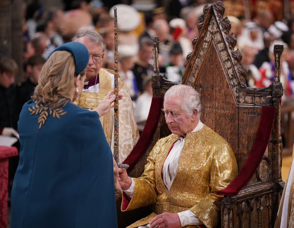 LONDON, ENGLAND - MAY 06: Lord President of the Council, Penny Mordaunt, presents the Sword of State to King Charles III during his coronation ceremony in Westminster Abbey on May 6, 2023 in London, England. The Coronation of Charles III and his wife, Camilla, as King and Queen of the United Kingdom of Great Britain and Northern Ireland, and the other Commonwealth realms takes place at Westminster Abbey today. Charles acceded to the throne on 8 September 2022, upon the death of his mother, Elizabeth II. (Photo by Victoria Jones  - WPA Pool/Getty Images)