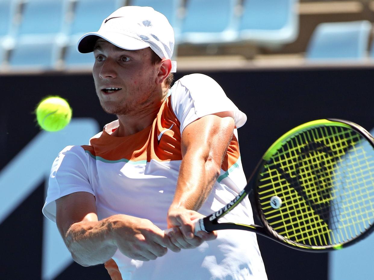Miomir Kecmanovic plays a backhand in the third round of the Australian Open.