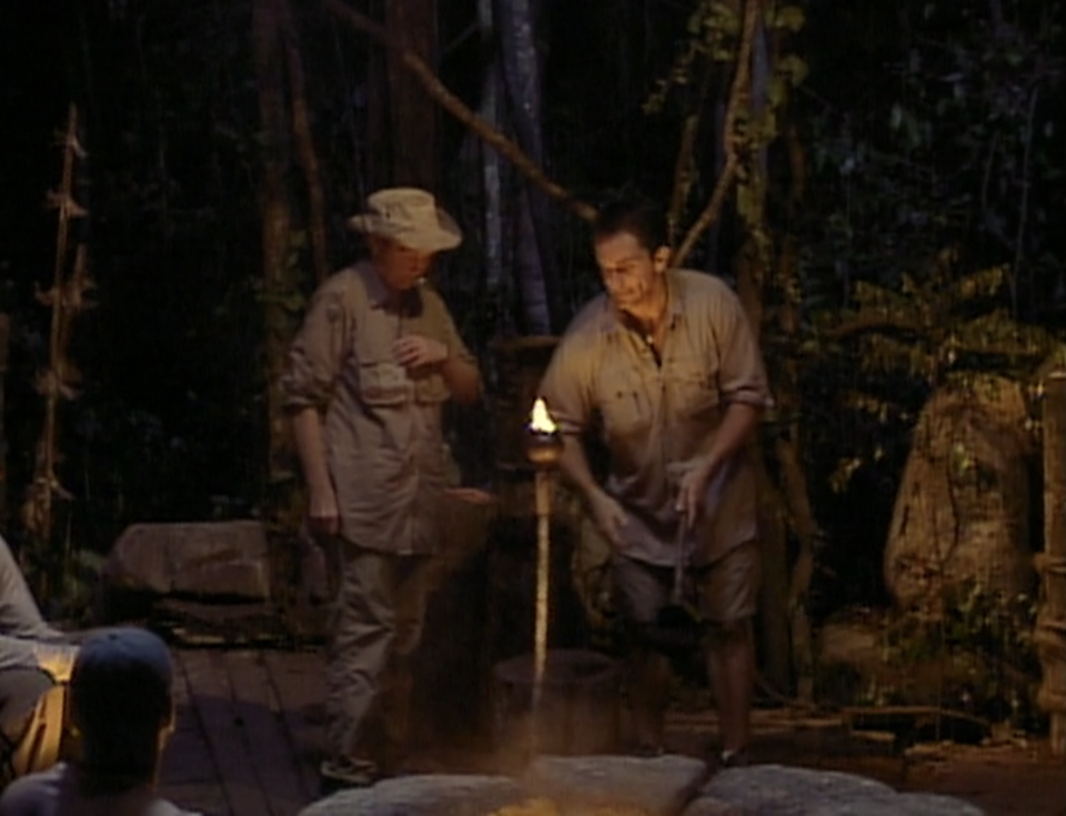 Jeff Probst extinguishes Sonja Christopher's torch in Survivor: Borneo