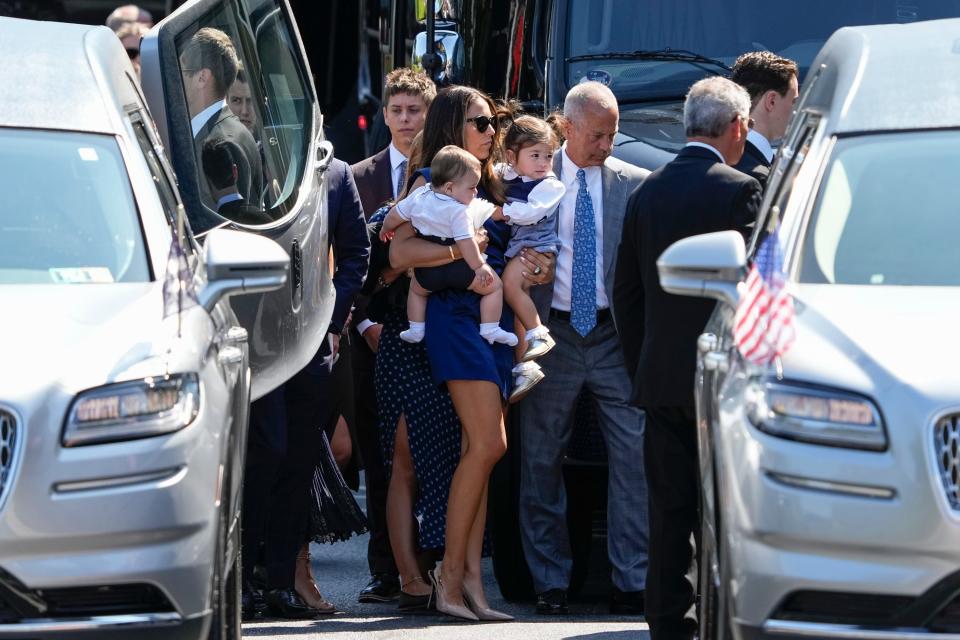 September 9, 2024; Media, Pennsylvania, USA; Meredith Gaudreau arrives with her children Noa and Johnny at St. Mary Magdalen Parish for the funeral service for her husband, Columbus Blue Jackets hockey player Johnny Gaudreau, and his brother Matthew Gaudreau. The brothers died after being struck by an alleged drunk driver while riding bicycles on August 29.