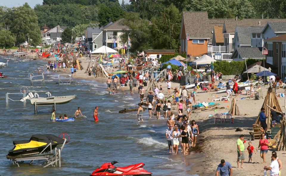 A view of part of the huge crowd at the July 4 party on a hot and humid Crescent Beach along Lake Ontario in Greece, NY. 