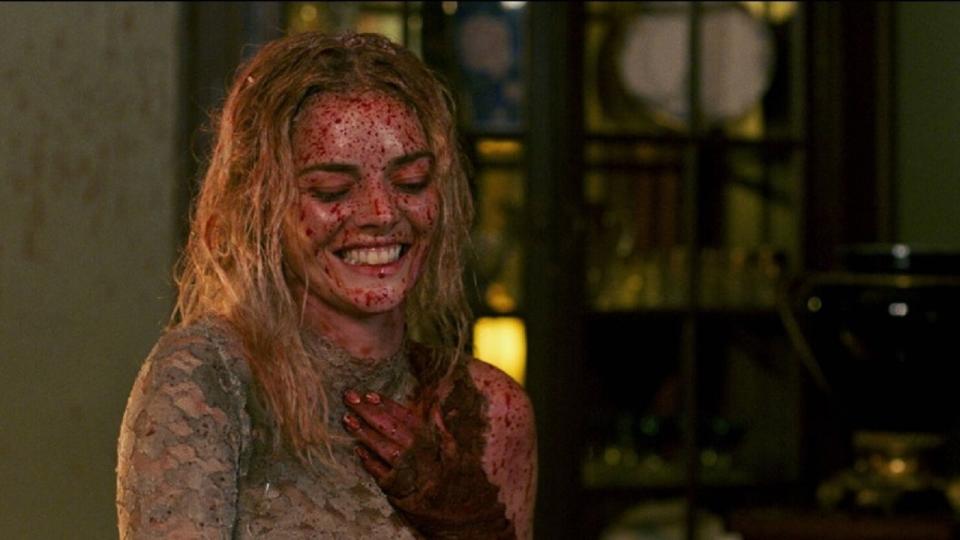 A bloody and relieved Grace (Samara Weaving) in Ready or Not