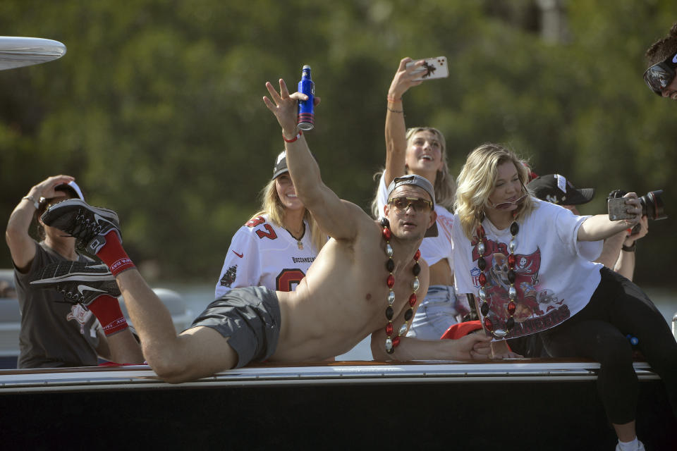 Tampa Bay Buccaneers NFL football tight end Rob Gronkowski waves during a celebration of their Super Bowl 55 victory over the Kansas City Chiefs with a boat parade in Tampa, Fla., Wednesday, Feb. 10, 2021. (AP Photo/Phelan Ebenhack)