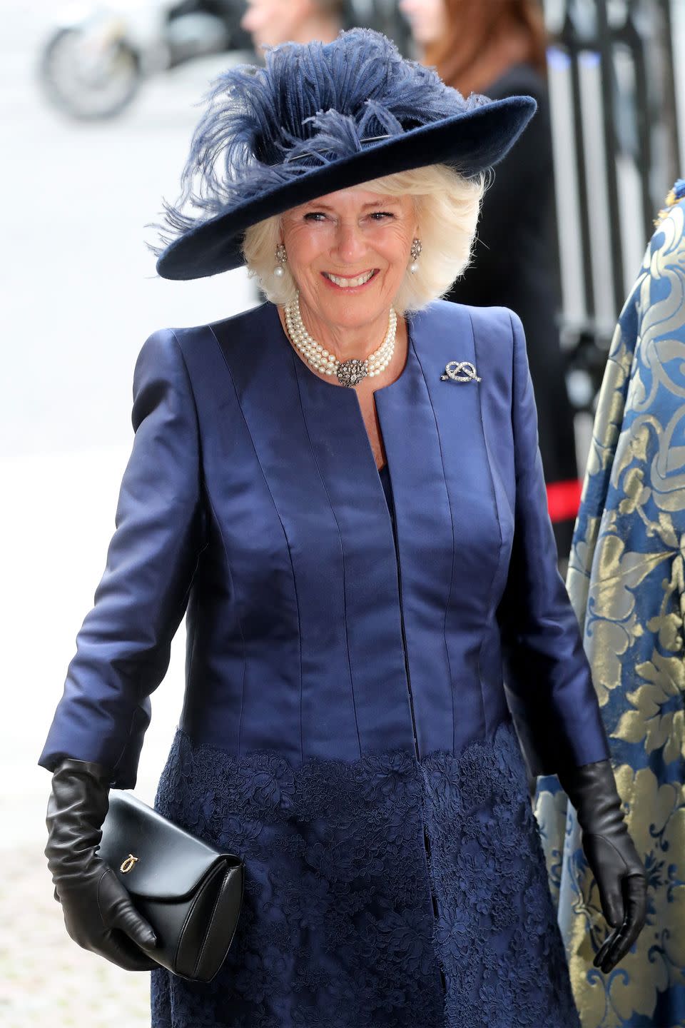 <p>The Duchess of Cornwall smiles as she enters Westminster Abbey.</p>