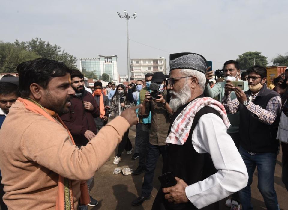 A member of a radical Hindu group confronts a Muslim worshipper on December 3, 2021 in Gurugram, India.<span class="copyright">Vipin Kumar/Hindustan Times via Getty Images</span>