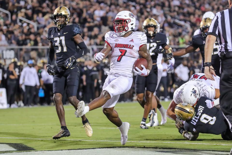 Sep 9, 2022; Orlando, Florida, USA; Louisville Cardinals running back Tiyon Evans (7) scores a touchdown during the first quarter against the UCF Knights at FBC Mortgage Stadium. Mandatory Credit: Mike Watters-USA TODAY Sports