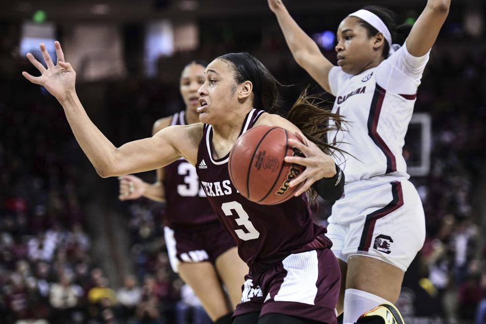 Texas A&M guard Chennedy Carter (3) drives against South Carolina guard Zia Cooke (1) during the second half of an NCAA college basketball game Sunday, March 1, 2020, in Columbia, S.C. South Carolina defeated Texas A&M 60-52. (AP Photo/Sean Rayford)