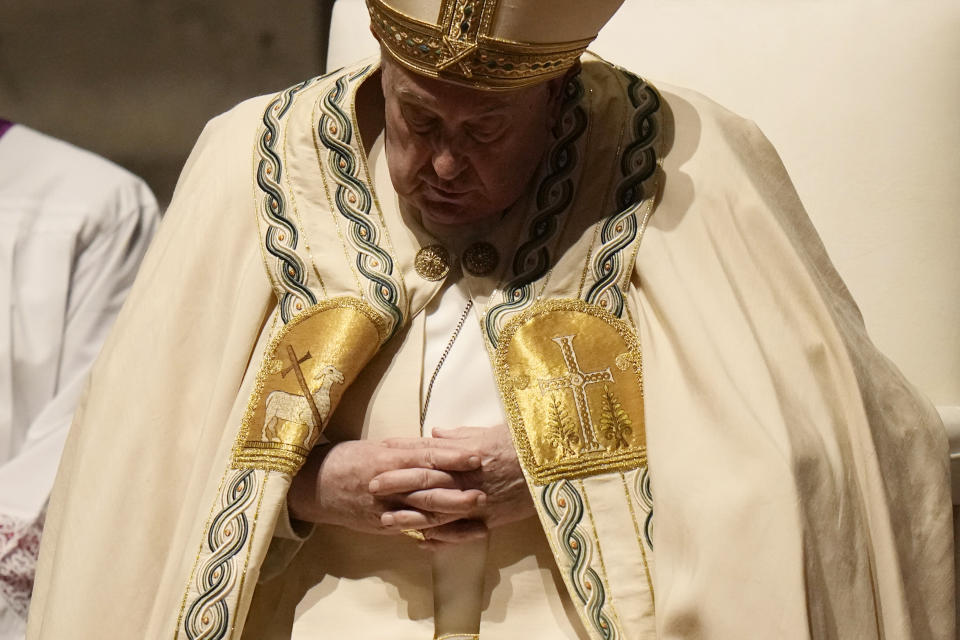 Pope Francis presides over the Easter vigil celebration in St. Peter's Basilica at the Vatican, Saturday, March 30, 2024. (AP Photo/Alessandra Tarantino)